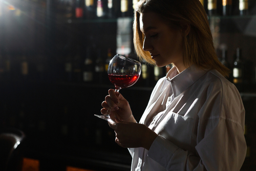 waiter smelling wine