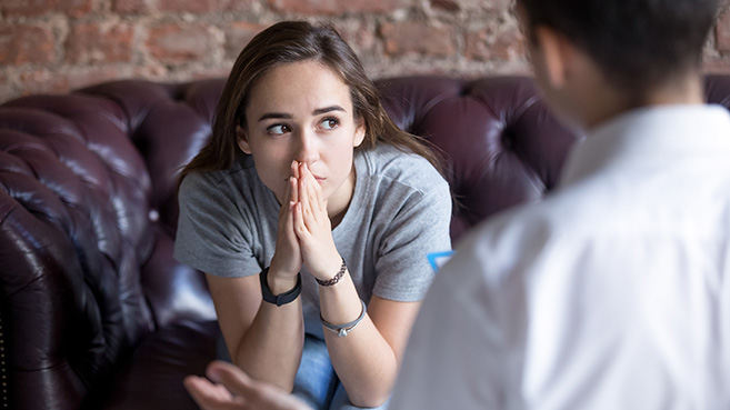 Young woman receiving counselling