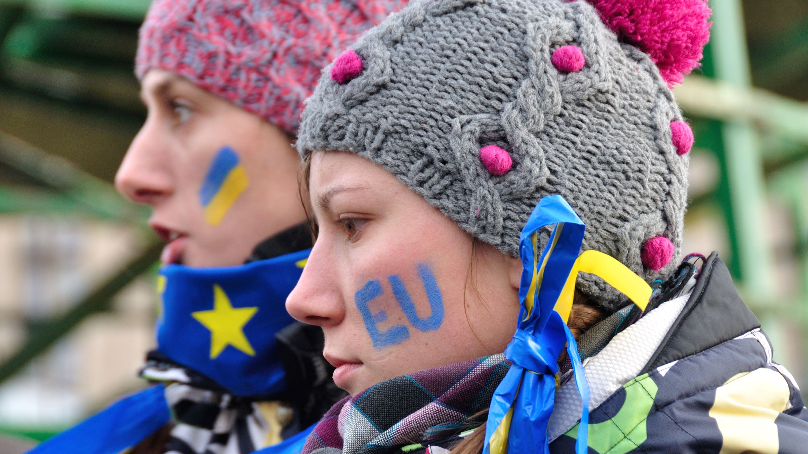 People wearing Ukraine and EU flag symbols
