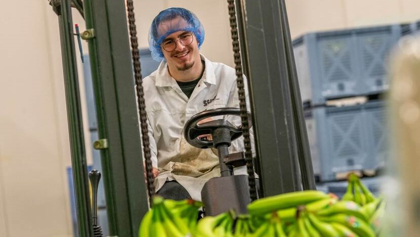 A man driving a forklift truck