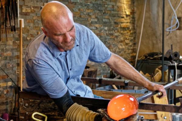man in small glass-blowing business