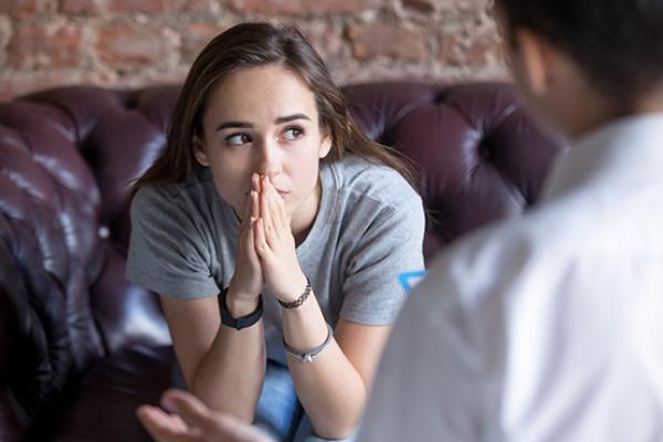 Young woman receiving counselling