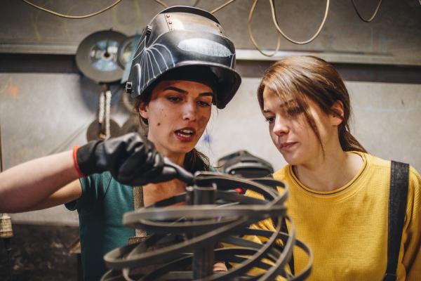 Two women working on metallurgy